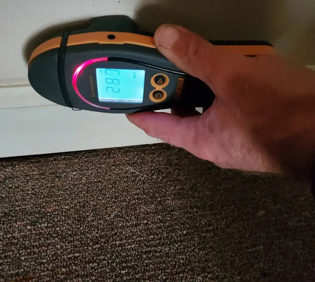Moisture detection at baseboard during Sewage Cleanup & Sanitation in Glenpool